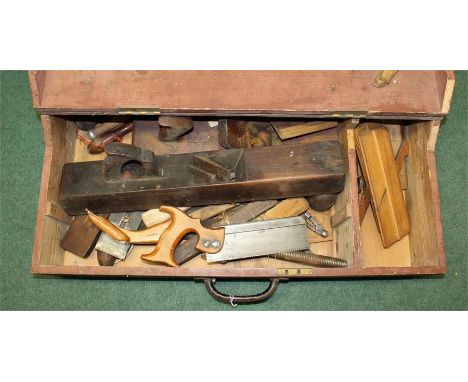 Trunk containing various tools including a collection of wooden planes (qty)