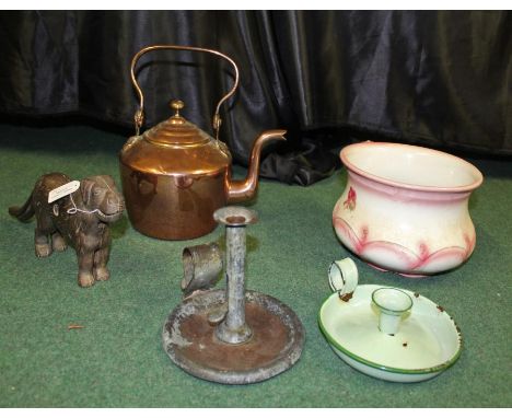 Novelty metal dog nut crackers, together with a George Bill Chamber stick and a copper teapot, chamber pot and an enamel cham