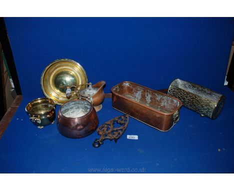 A quantity of brass and copper to include a plant trough, a small coal bucket with a ceramic handle, a brass trough in the fo