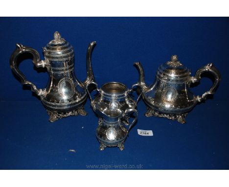 A Victorian silver plated Tea/Coffee service with fruit finials, engraved oval panels, comprising Teapot, Coffee pot, sugar b