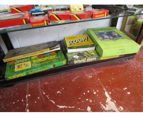 Shelf of vintage games to include Subbuteo