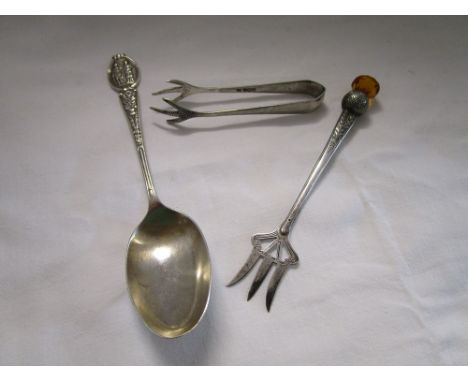 Silver spoon, fork and sugar nips