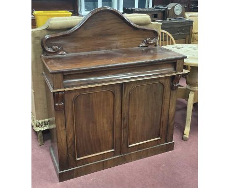 XIX Century mahogany Chiffonier with shaped back, concave drawer over cupboard doors and plinth base, 108cm wide.