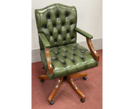 Green Leather Office Swivel Armchair, with button back and seat, stud decoration, open arms on shaped supports.