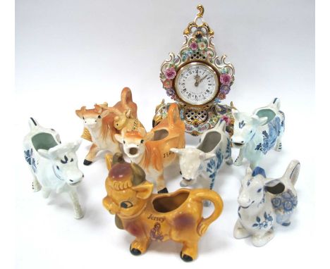 German Pottery Cased Mantle Clock, seven pottery cows:- One Tray.