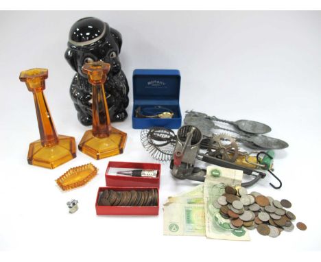 Coinage- one pound banknotes, amber glass candlesticks, Rotary watch, piggy bank, kitchen ware, continental spoons, etc:- One