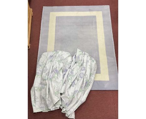 A Laura Ashley Wool Rug from the Elements Collection, colour Paradox with a lilac floral design on a pale grey ground, 160 x 