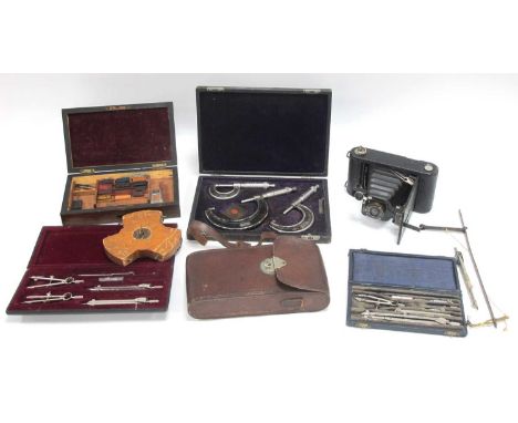 A Victorian Wooden Paint Box and Contents, a folding Kodak autographic camera and case, boxed sets of micrometres, draughtsma