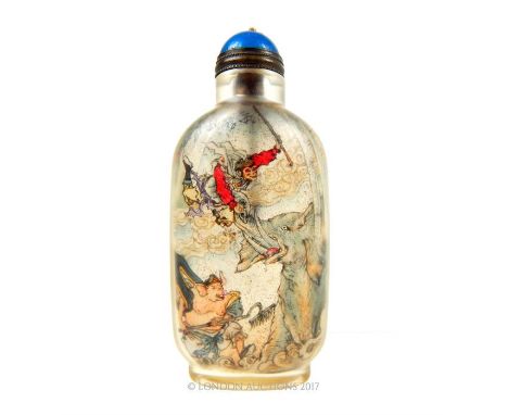 A Chinese, glass snuff bottle with snuff scoop, the exterior of the clear glass bottle reveals painted scenes within depictin