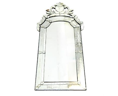 A large, fine, Venetian style mirror with delicately engraved and moulded glass details. In excellent condition with no chips