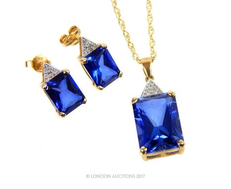 A boxed, 9 ct yellow gold, diamond and blue stone suite of jewellery to include a 9 ct yellow gold chain (25 cm) suspended by