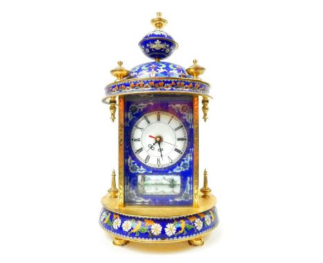 A 20th century cloisonne domed table clock with Roman numeral enamel dial and hand painted decorated panels; battery powered;