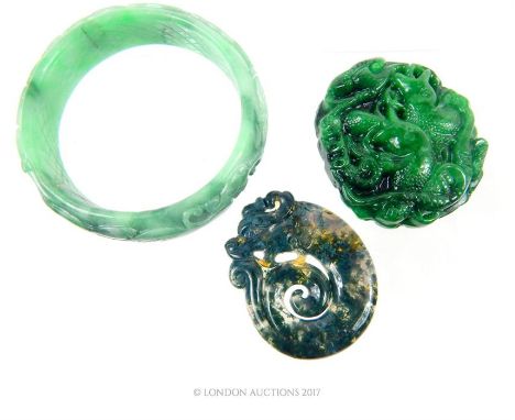 Three, Chinese carved items to include a carved, green jade bangle (Dia: 7 cm), a dark, nephrite jade pendant depicting a coi