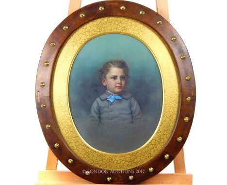 A 19th century oval portrait of a young boy; sight size 41.5cm oval.