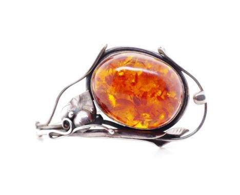 Australian sterling silver and amber bangle marked 925. With a decorated gum leaf designed setting. Approx cognac amber size 