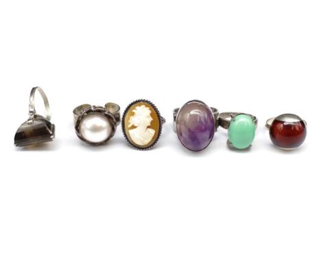Five gemstone and silver rings includes, amethyst, mabe pearl and cameo examples. Mixed silver marks. Approx size M &amp; P. 