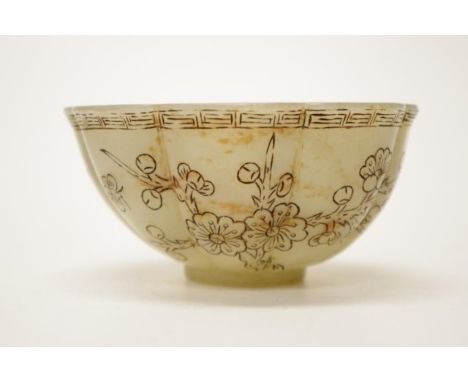 Chinese carved green jade bowl decorated with calligraphy and flowers. 10cm diameter at top.