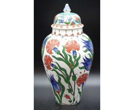 Turkish Iznik ceramic lidded vase carnation and tulip decoration, (height 24cm approx).