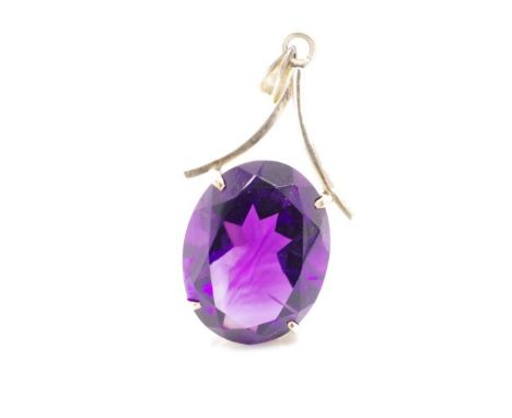 Amethyst and 14ct rose gold pendant marked K18. Approx total weight 3.7 grams, amethyst size 15.6mm x 12.6mm x 8.1mm