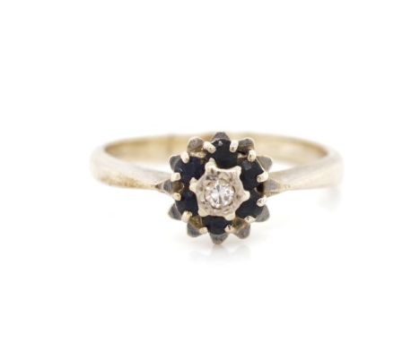 Diamond and sapphire set 18ct white gold ring rubbed 18ct marks. Approx weight 3 grams, ring size K