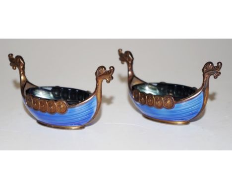 Pair Norwegian sterling silver &amp; enamel open salts each of Viking Ship form, with blue glass liners, marked to base, (len