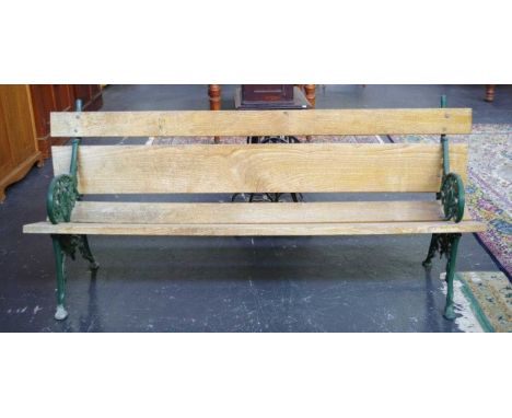 Garden bench seat with ornate cast iron ends, 194cm wide, 86cm high approx