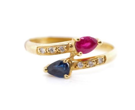 Diamond and sapphire set 18ct yellow gold ring also set with a synthetic ruby. Marked 750. Approx weight 1.8 grams, ring size