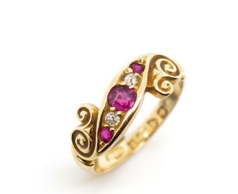 Edwardian ruby and diamond set 18ct gold ring marked Chester 18 1902. Approx two old cut diamonds, three rubies, weight 2.9 g