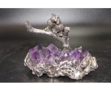 Silver birds figure on amethyst crystal base depicting 2 cockatoos on a silver branch, on decorated silver cased base, enclos