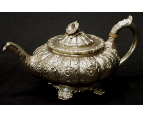 Good George IV sterling silver teapot London 1828, maker William Eaton, embossed decoration, blossom form finial to lid, (hei