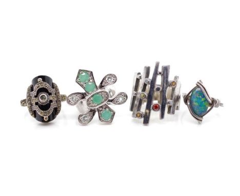 Four silver and gemstone rings includes opal triplet, chrysoprase, and onyx examples. Mostly marked 925. Approx weight 29 gra