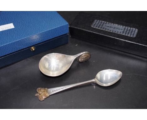 Sterling silver caddy spoon in original box hallmarked London 1975, with a Honi soit qui mal y pense inset handle, together w