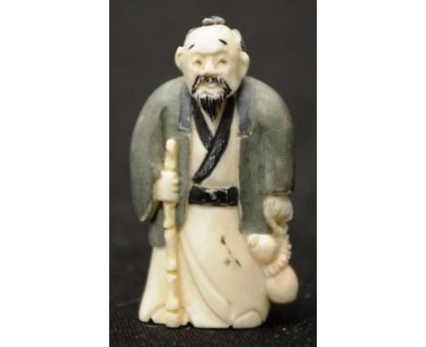 Early carved Ivory sage holding a stick netsuke C1940, signed to base, height 7.5cm approx. NB.This item cannot be exported.