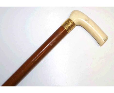 Edwardian walking stick with ivory handle, horn foot and 18ct gold collar hallmarked Sheffield 1910, 77.5cm long.NB This item