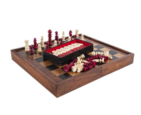 AN EBONY AND IVORY INLAID FOLDING ANTIQUE CHESS AND BACKGAMMON BOX, the interior decorated with two inlaid ivory and marquetr