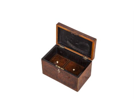 A GEORGE IV BURR YEW WOOD RECTANGULAR TEA CADDY, with white metal hinged handle, decorated with boxwood and ebon stringing, t