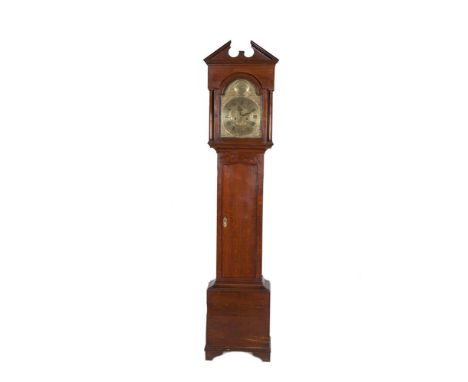 A GEORGE II OAK LONGCASE CLOCK, the tall hood with broken pediment above a brass face with dolphin spandrels, date aperture a