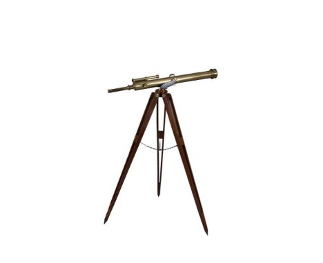 A VICTORIAN BRASS TELESCOPE, by Broadhurst, Clarkson & Co., London, on a mahogany tripod, complete with original stained wood