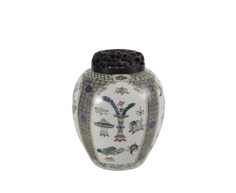 A LARGE CHINESE FAMILLE VERTE JAR AND COVER, Kangxi period (1661-1722), fitted with pierced floral carved cover, the ovoid bo