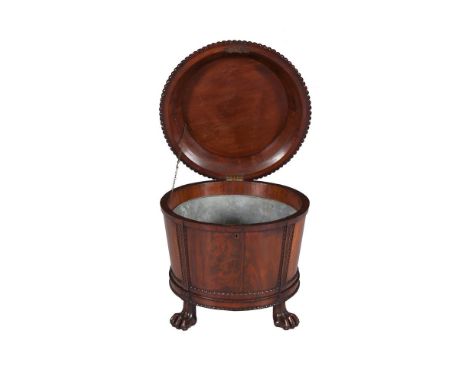 AN EXCEPTIONAL AND LARGE GEORGE III MAHOGANY CIRCULAR CELLARETTE of tapered form with domed hinged lid decorated with radial 