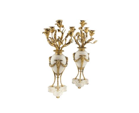 A PAIR OF LOUIS XVI WHITE OVOID MARBLE AND ORMOLU FOUR-LIGHT CANDELABRA, each with four naturalistic floral branches and flow