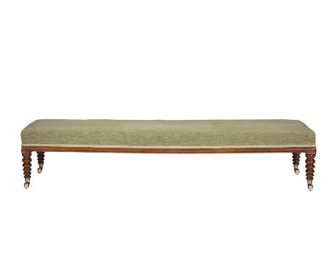 AN IRISH VICTORIAN MAHOGANY FRAMED WINDOW SEAT, by Robert Strahan of Dublin, with olive green upholstery, on bobbin turned le