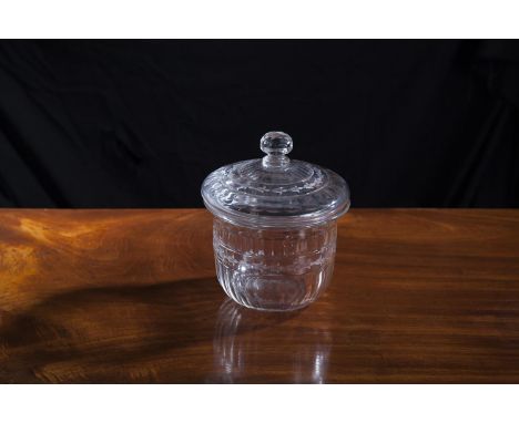A 19TH CENTURY CUT GLASS BISCUIT BARREL AND COVER, of circular form with domed lid and facetted finial, the fluted body decor