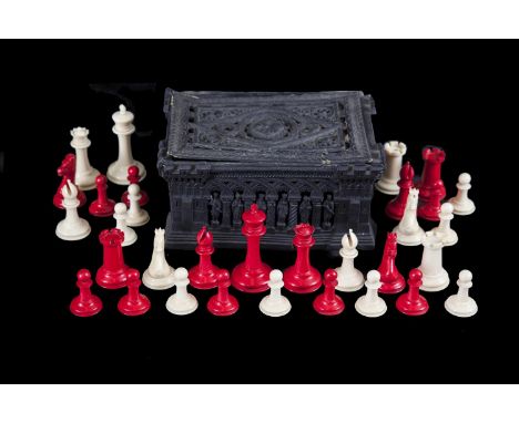 AN EARLY JAQUES STAUNTON OF LONDON IVORY ANTIQUE CHESS SET, c.1850, one side stained red and the other left natural, some pie