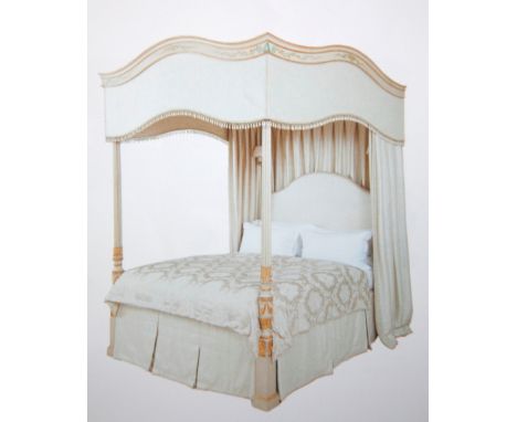 A MODERN PAINTED TIMBER FOUR POSTER CANOPY BED, the undulating cornice with painted floral decoration, raised on painted and 