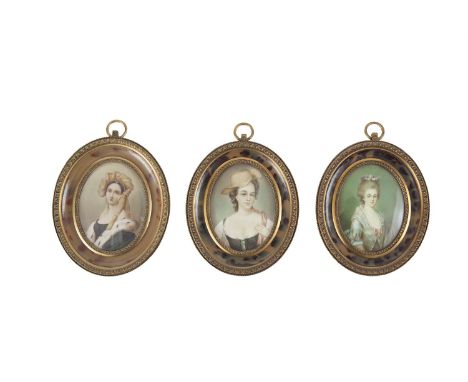 A SET OF THREE MINIATURE PORTRAITS ON IVORY, of beauties, late 19th century, framed as a set in machined brass and faux torto