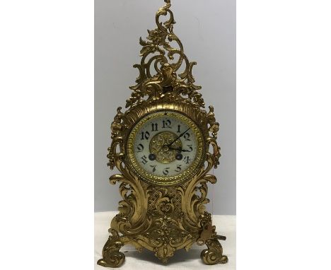 Decorative brass mantle clock with enamel face (cracked) French movement. 40cms h.