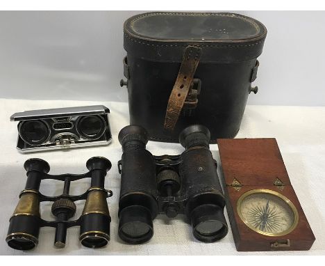 Leather cased binoculars, brass opera glasses, mahogany cased compass and pair of pocket opera glasses, 25 x 25cms. 
