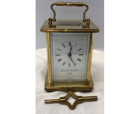 Brass carriage clock, 8 day movement by Matthew Norman, London, with key.