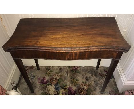 Serpentine mahogany card table, circa 1800. 91 w x 73 h x 43 cms d.